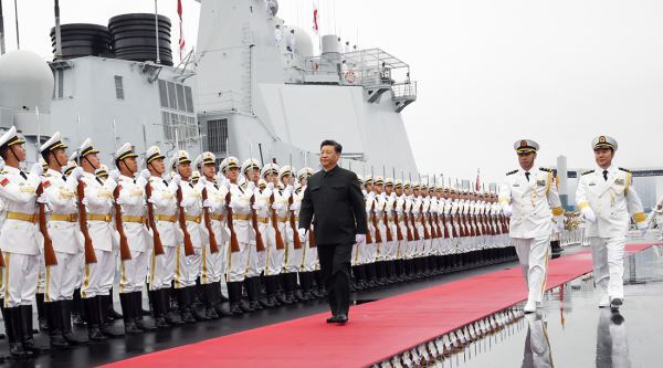 China's President and Central Military Commission Chairman Xi Jinping inspects the honor guards of the Chinese People's Liberation Army Navy before boarding the destroyer Xining at a pier in Qingdao, Shandong Province on Tuesday, April 23, 2019. [Photo: Xinhua]